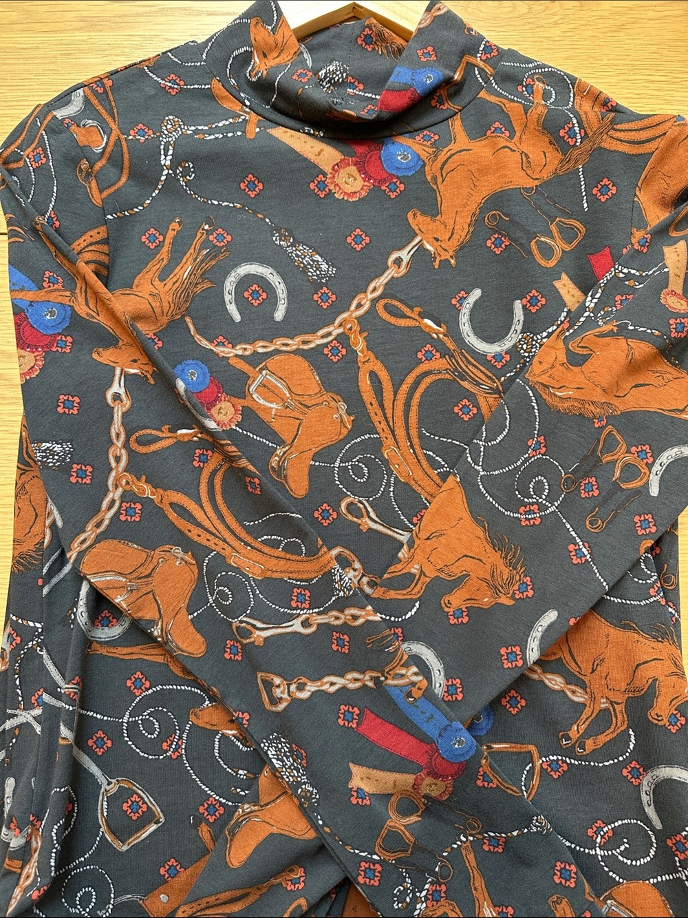 Anthropologie Turtleneck with Rust Equestrian Motif and Blue Accents